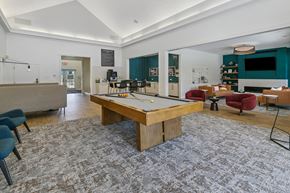 Lincoln apartment for rent - A room with a pool table and a bar at The Donovan Apartment Homes, Lincoln, NE