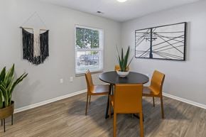 Lincoln apartment for rent - A dining room with a round table and chairs at The Donovan Apartment Homes, Lincoln, Nebraska