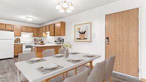 Isanti apartment for rent - our modern kitchen and dining room with a white table and chairs