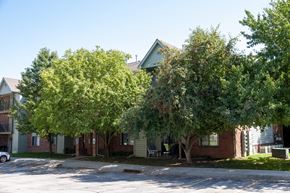 Omaha apartment for rent - Large Trees Covering Greenfield Apartment Building