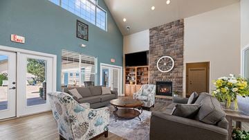 Rapid City apartment for rent - a living room with couches and a clock on the wall