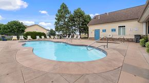 Rapid City apartment for rent - our resort style pool is next to our building and has chairs around it