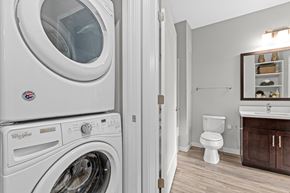 New Hope apartment for rent - A Whirlpool washing machine is in a laundry room with a toilet and sink.