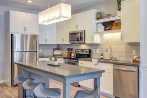 New Hope apartment for rent - Modern kitchen with bright white cabinetry, stainless steel appliances, and custom kitchen islands.