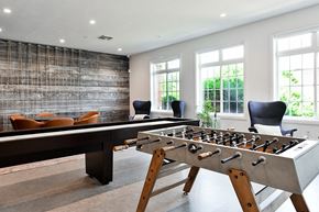 Lincoln apartment for rent - a game room with a foosball table and chairs