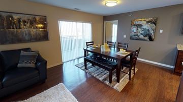 Bismarck apartment for rent - a dining room and living room with a table and chairs