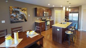 Bismarck apartment for rent - a kitchen and dining room with a wooden table