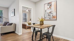 Denver apartment for rent - A dining room with a table, chairs and a painting on the wall.