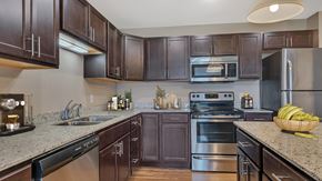 Monticello apartment for rent - a modern kitchen with stainless steel appliances and granite counter tops