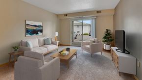 Monticello apartment for rent - a living room with a couch and chairs and a tv