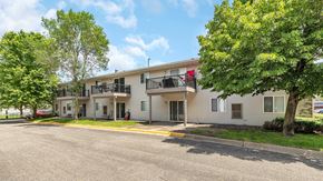Monticello apartment for rent - an apartment building with a street and trees in front of it