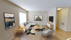 Bismarck apartment for rent - Open living space with bright natural light from large window on left wall.