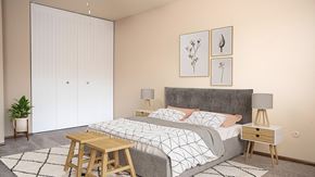 Roseville apartment for rent - A bedroom with a bed, nightstands, and a plant.