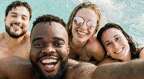 Roseville apartment for rent - a group of people in a swimming pool