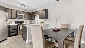 Plymouth apartment for rent - a kitchen and dining room with a table and chairs