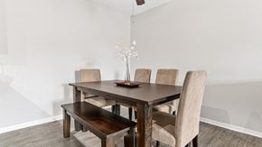 Plymouth apartment for rent - a dining room with a wooden table and chairs