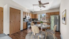 Rapid City apartment for rent - a kitchen and dining room with a table and chairs