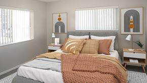 Rochester apartment for rent - a bedroom with a bed and two windows