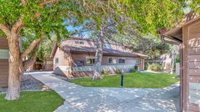 Billings apartment for rent - a house with a sidewalk and trees in front of it