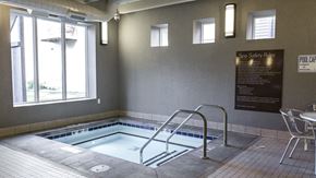 Bismarck apartment for rent - a hot tub in a room with a window