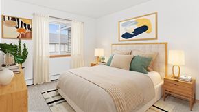 Isanti apartment for rent - a bedroom with a bed and paintings on the wall