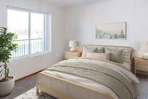 Rochester apartment for rent - a bedroom with a bed and a window