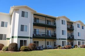 Jamestown apartment for rent - Exterior of The Meadows Apartments with multiple large windows and balconies.