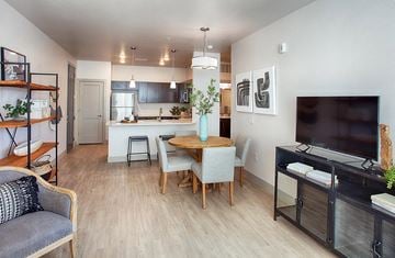 Longmont apartment for rent - a living room and kitchen with a table and a tv