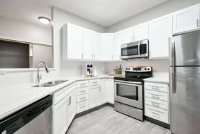 Lincoln apartment for rent - Modern and spacious kitchen with white cabinetry, stainless steel appliances, and plenty of storage.