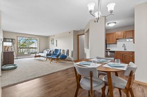 Rochester apartment for rent - A dining room with a table set for four.