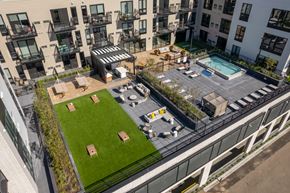 Minneapolis apartment for rent - an aerial view of an apartment complex with a lawn and a pool