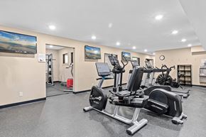 Roseville apartment for rent - A gym with a row of exercise bikes.