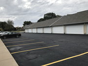 Mishawaka townhouse for rent - a parking lot with a building in the background