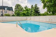 Mishawaka apartment for rent - A small pool with a metal fence around it.