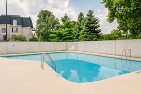 Mishawaka apartment for rent - A small pool with a metal fence around it.