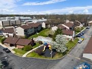 Mishawaka apartment for rent - an aerial view of a neighborhood of houses with a playground and a pool at The Element @ St Andrews, Mishawaka, Indiana