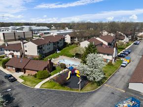Mishawaka apartment for rent - an aerial view of a neighborhood of houses with a playground and a pool at The Element @ St Andrews, Mishawaka, Indiana