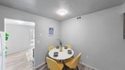 Trotwood apartment for rent - a dining room with a white table and yellow chairs