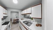 Mishawaka apartment for rent - a kitchen with white counter tops and a stainless steel sink at The Element @ St Andrews, Indiana, 46545