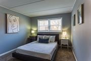 Oak Lawn apartment for rent - a small bedroom with a bed and a window