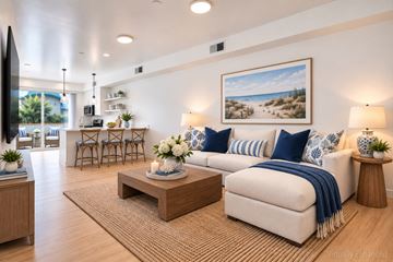 Santa Barbara apartment for rent - A living room with a white couch, a coffee table, and a painting on the wall.
