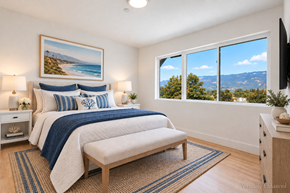Santa Barbara apartment for rent - A bedroom with a large bed and a view of the mountains.