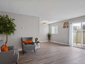 Pacifica apartment for rent - a living room with two chairs and a plant