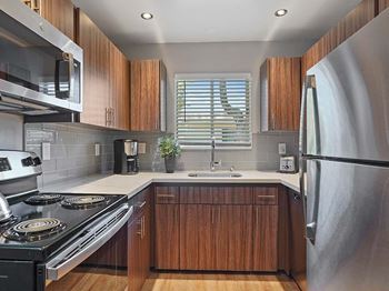 Upscale stainless steel kitchen appliances with double door refrigerator