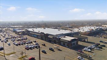 Parking lot with cars and building in the background
