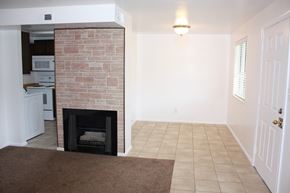 Orem apartment for rent - A room with a fireplace and a door.