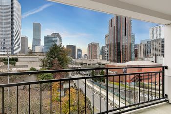 Balcony overlooks a cityscape with tall buildings4