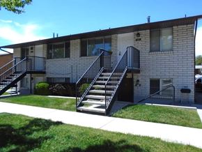Orem apartment for rent - A small building with a black metal staircase.