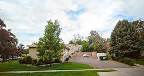 Provo apartment for rent - A residential street with houses and trees.
