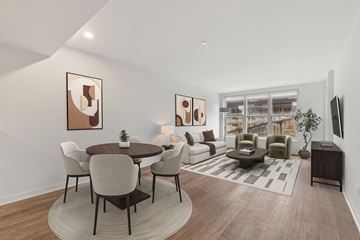 Seattle apartment for rent - A modern living room with a dining table and chairs.